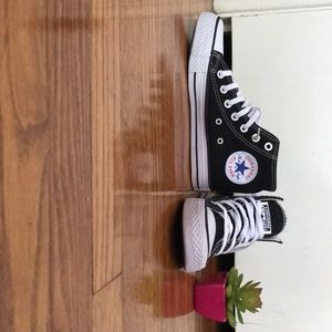 Black high top converse shoes